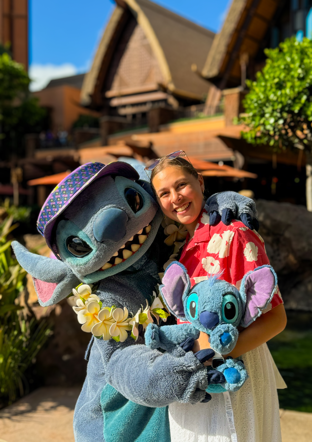 Kyree posing with Stitch character at Disney Parks